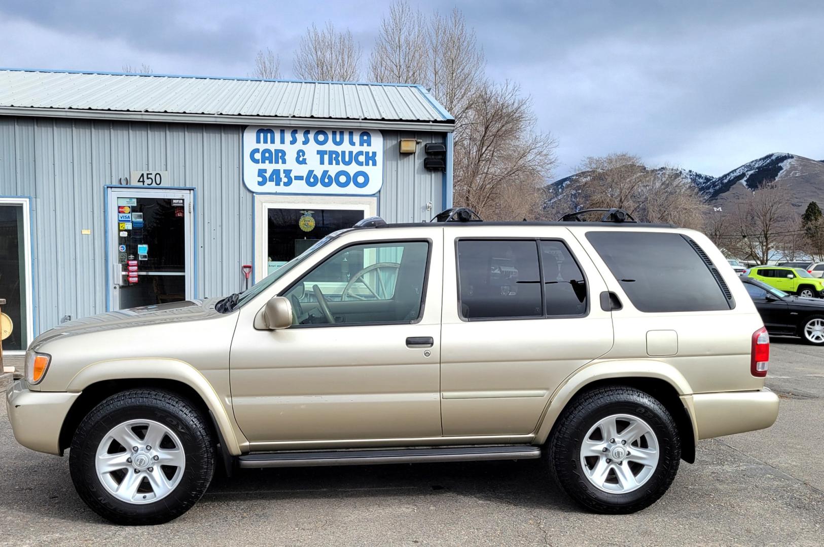 2002 Gold /Tan Nissan Pathfinder LE (JN8DR09Y22W) with an 3.5L v6 engine, Automatic transmission, located at 450 N Russell, Missoula, MT, 59801, (406) 543-6600, 46.874496, -114.017433 - 4WD SUV. 3.5L V6. Automatic Transmission. Heated Seats. Power Leather Seats. Power Sunroof. Air. Cruise. Tilt. AM FM CD Player. Power Windows and Locks. Because of the age, Financing is not available on this vehicle. - Photo#0